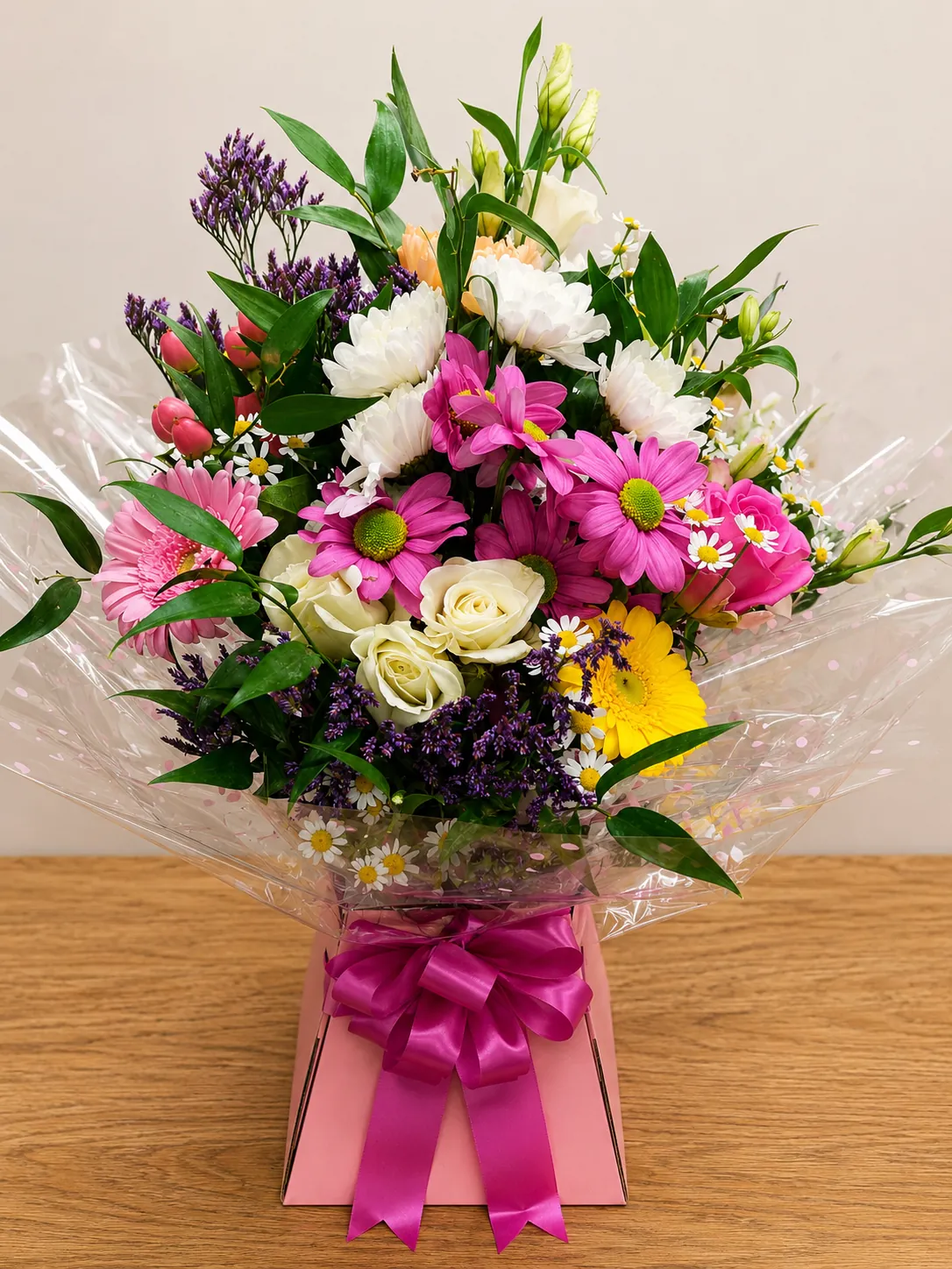 Pastel box arrangement with pink and white daisies and roses