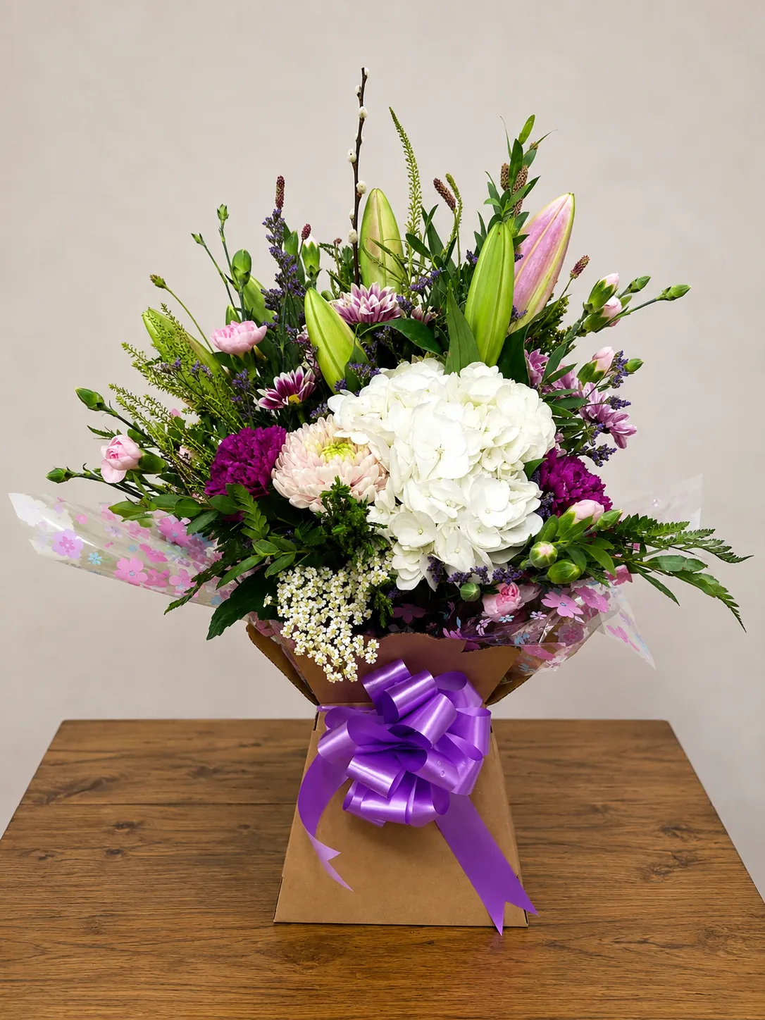 Rustic box arrangement with white hydrangea and blue cornflower