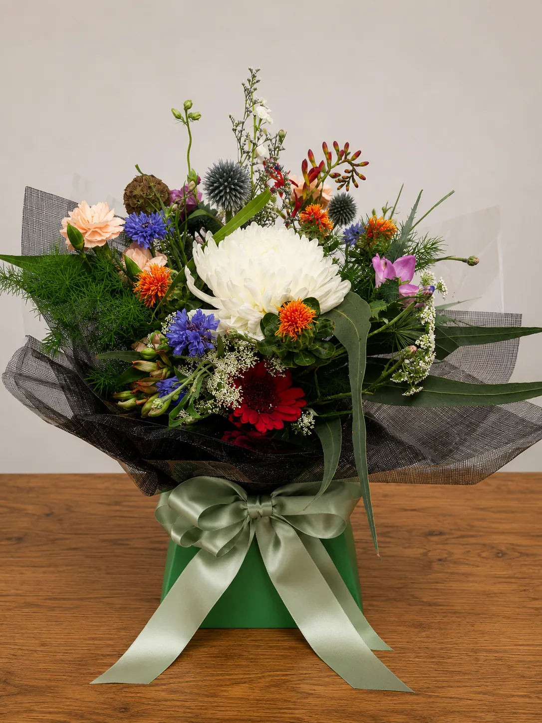 White and purple box arrangement with hydrangea and lilies