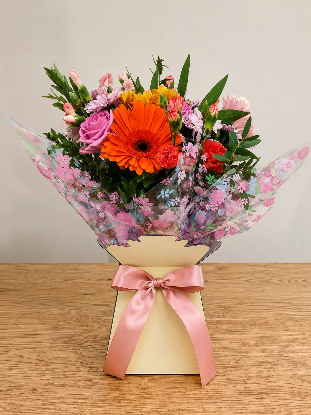 Bold box arrangement with orange gerbera and blue cornflower