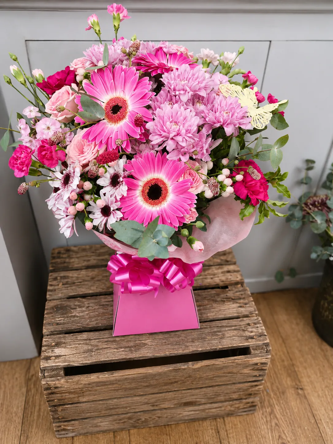Bright box arrangement with orange gerbera, pink roses and yellow chrysanthemum