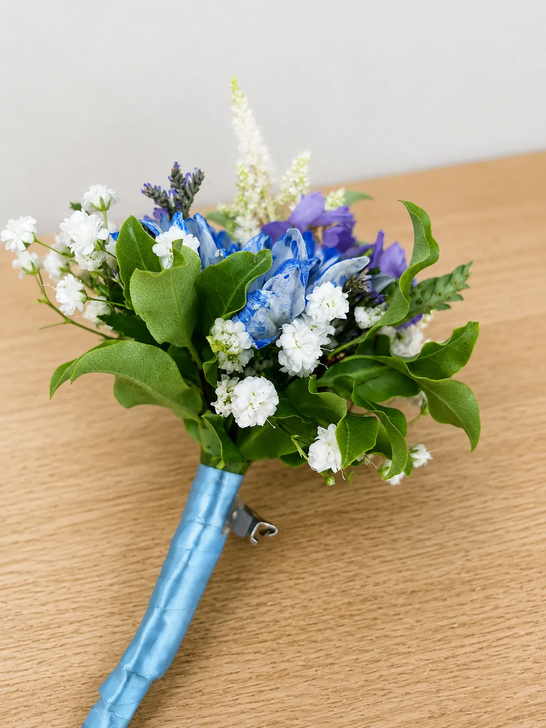 Blue and white wedding buttonhole with lavender sprigs