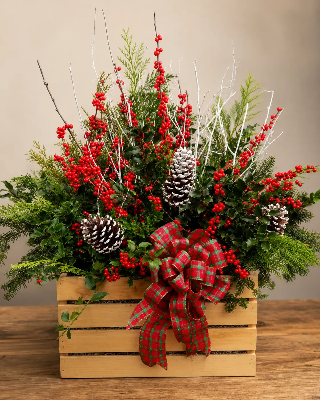 Rustic wooden crate arrangement filled with festive red and white Christmas flowers