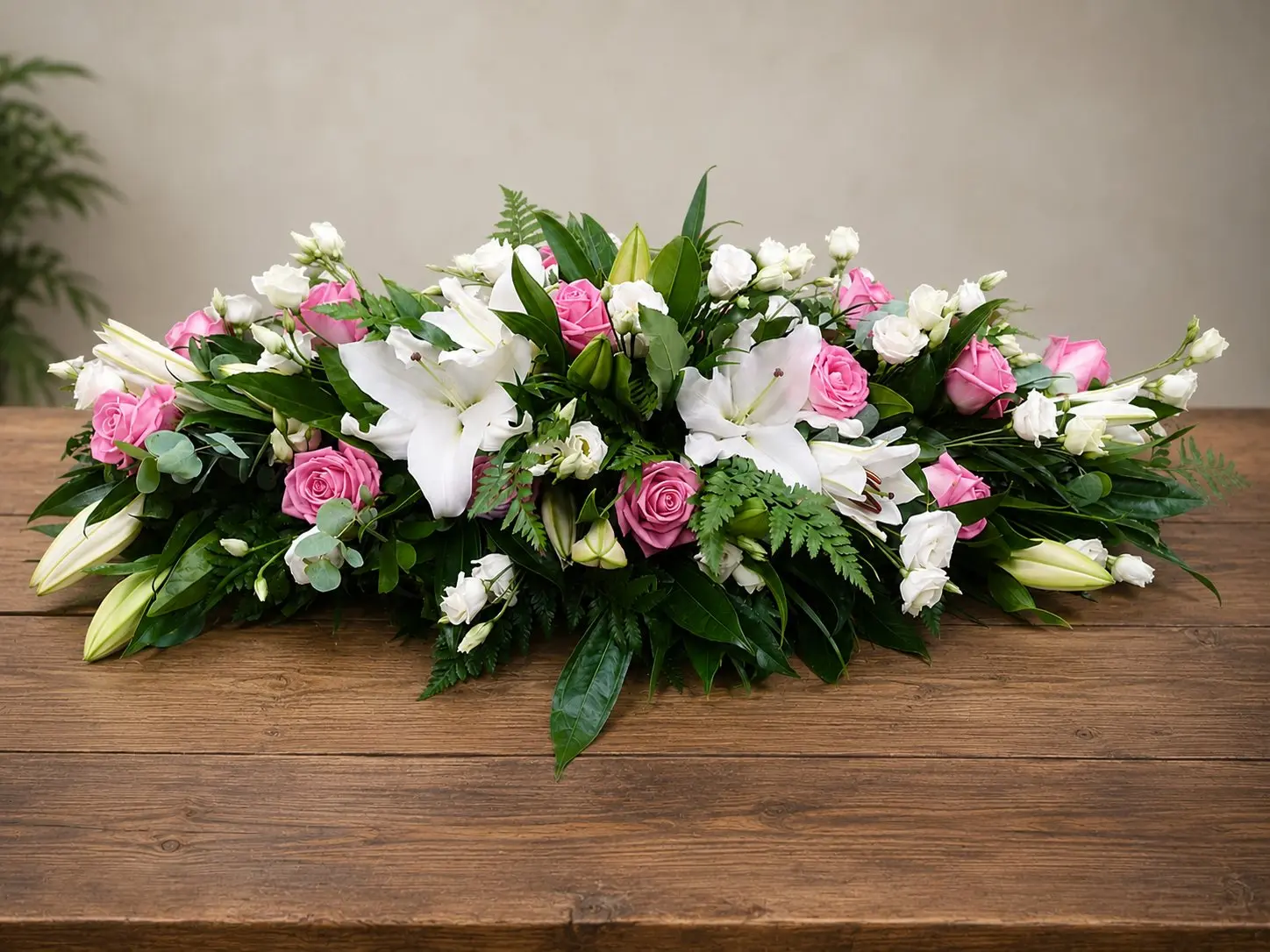 Pink rose and white lily casket spray funeral tribute by Quality Plants and Flowers